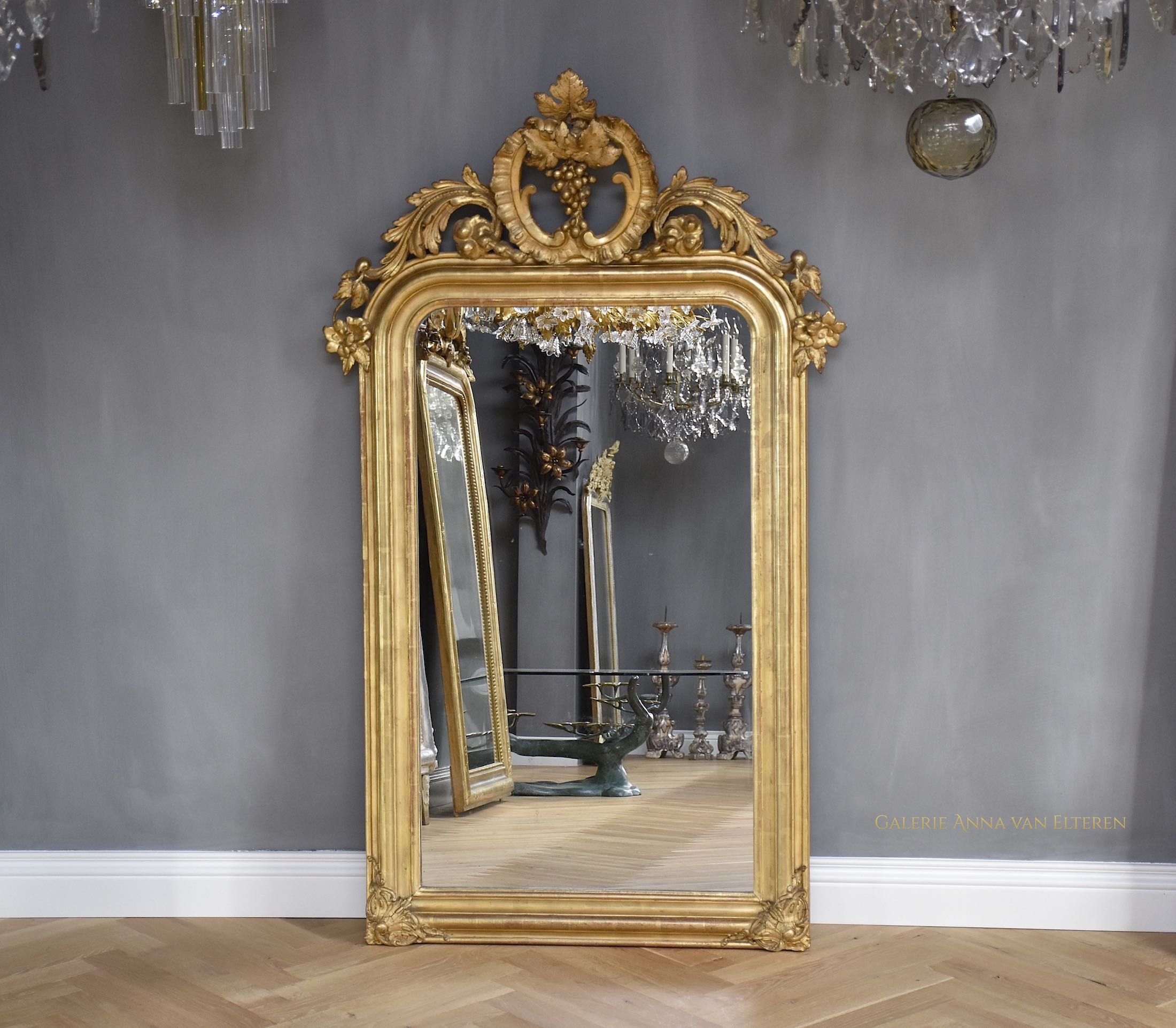 19th c. gilded and carved French mirror with a crown