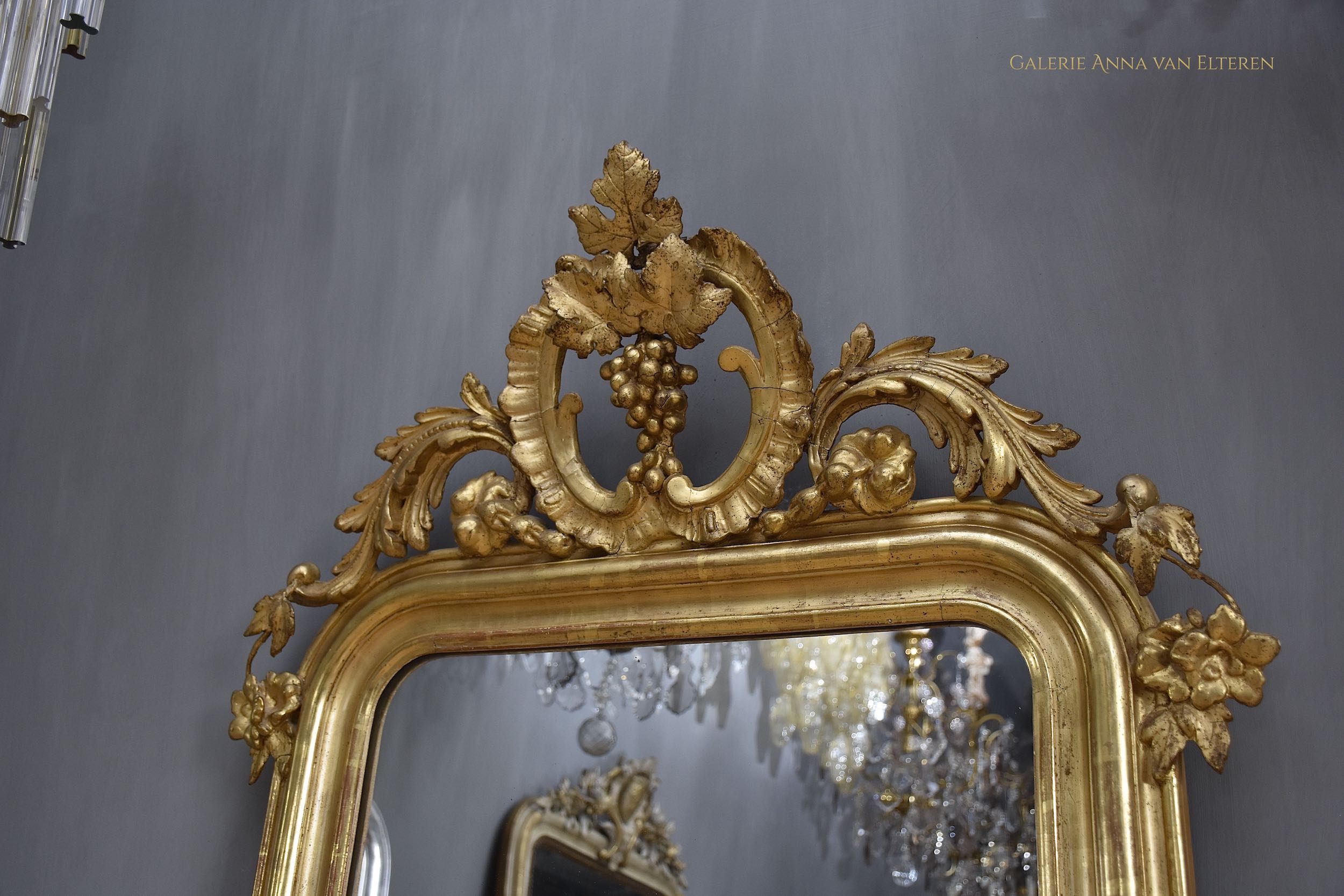 19th c. gilded and carved French mirror with a crown