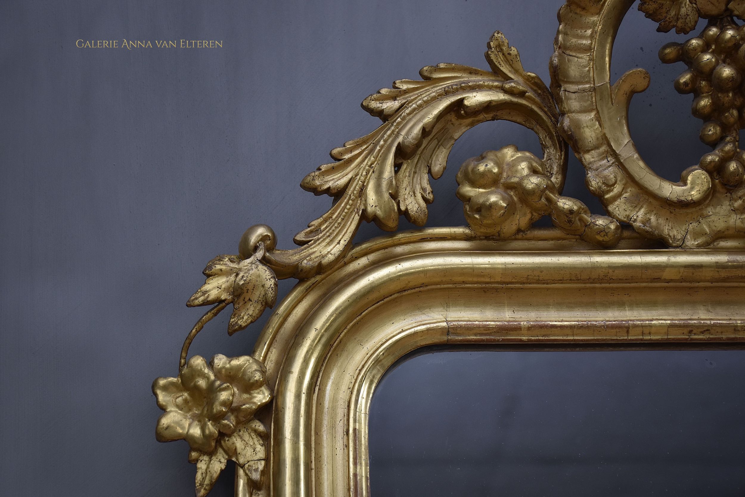 19th c. gilded and carved French mirror with a crown