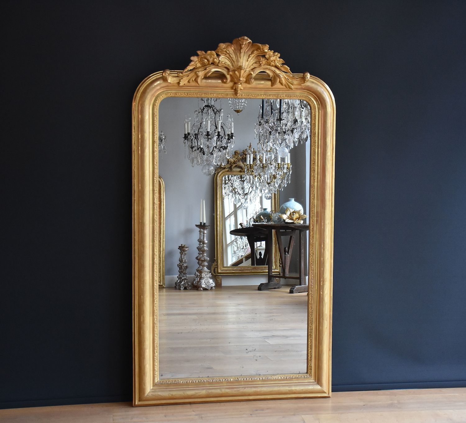 Antique French mirror with a crest