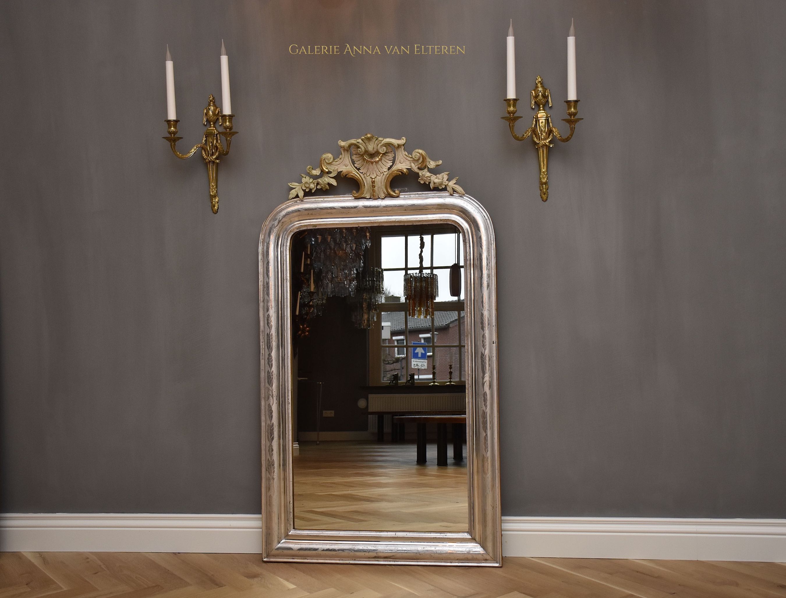 19th c. antique French mirror with a crest