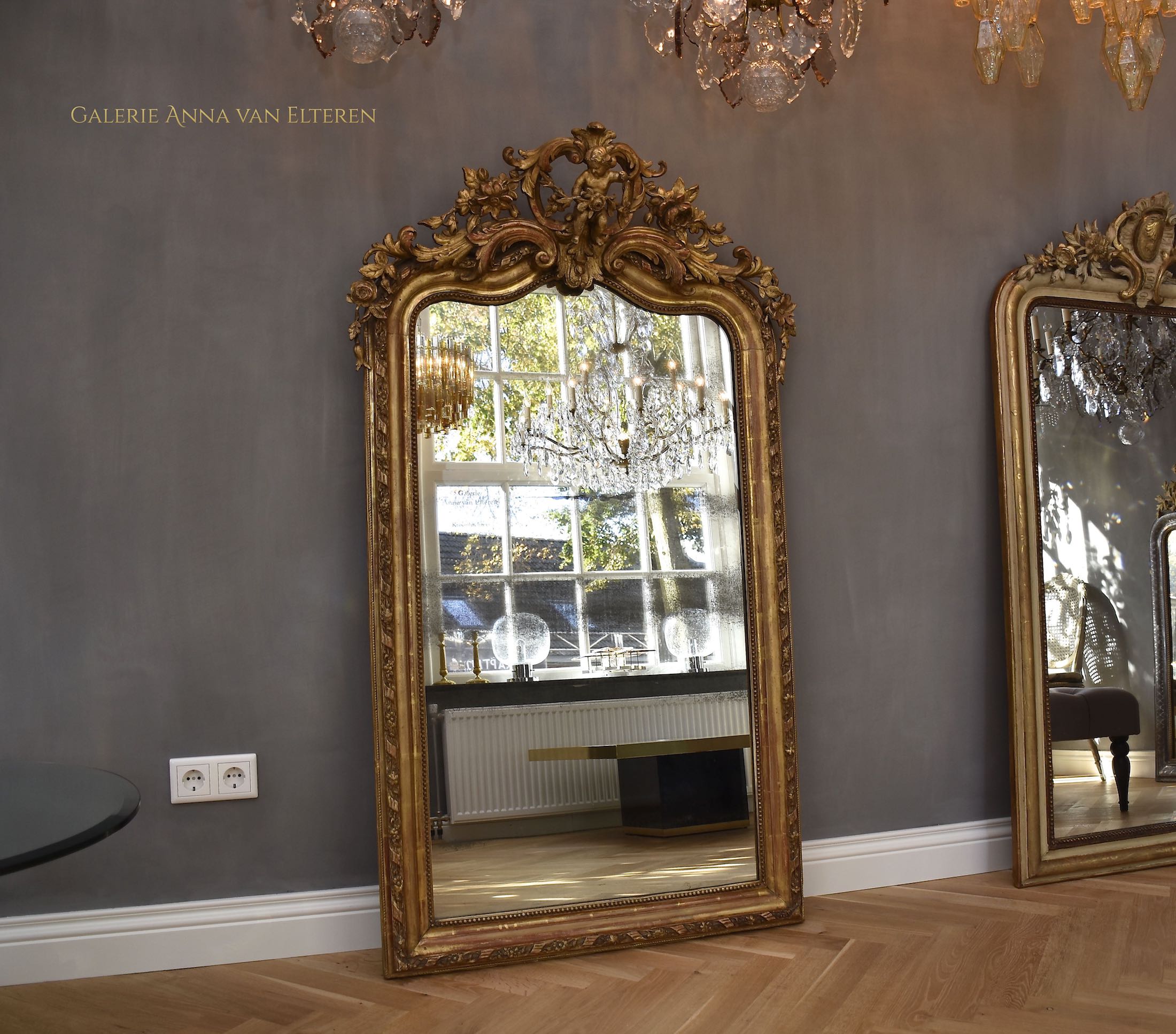 19th c. large impressive French mirror with a fabulous crown and putti