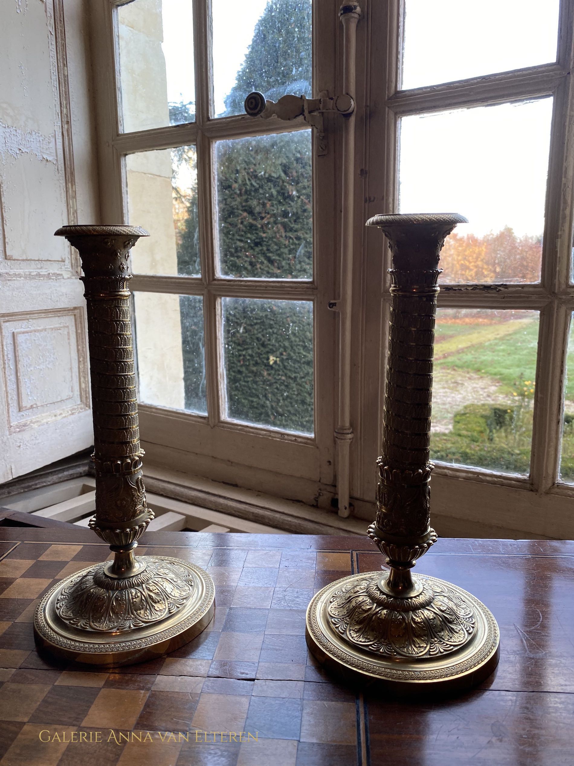 A fine pair of 19th c. gilt and chased bronze candlesticks