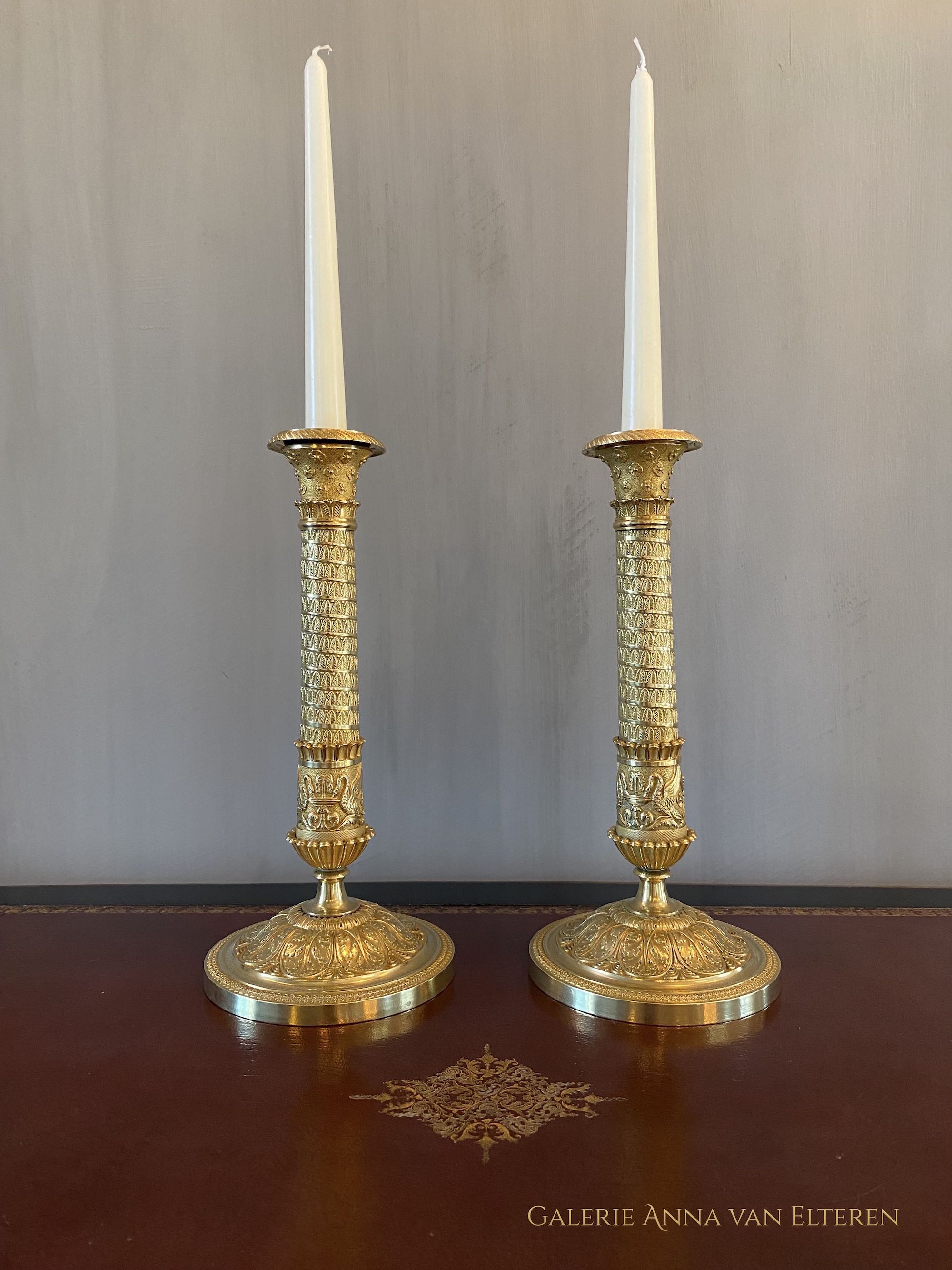 A fine pair of 19th c. gilt and chased bronze candlesticks