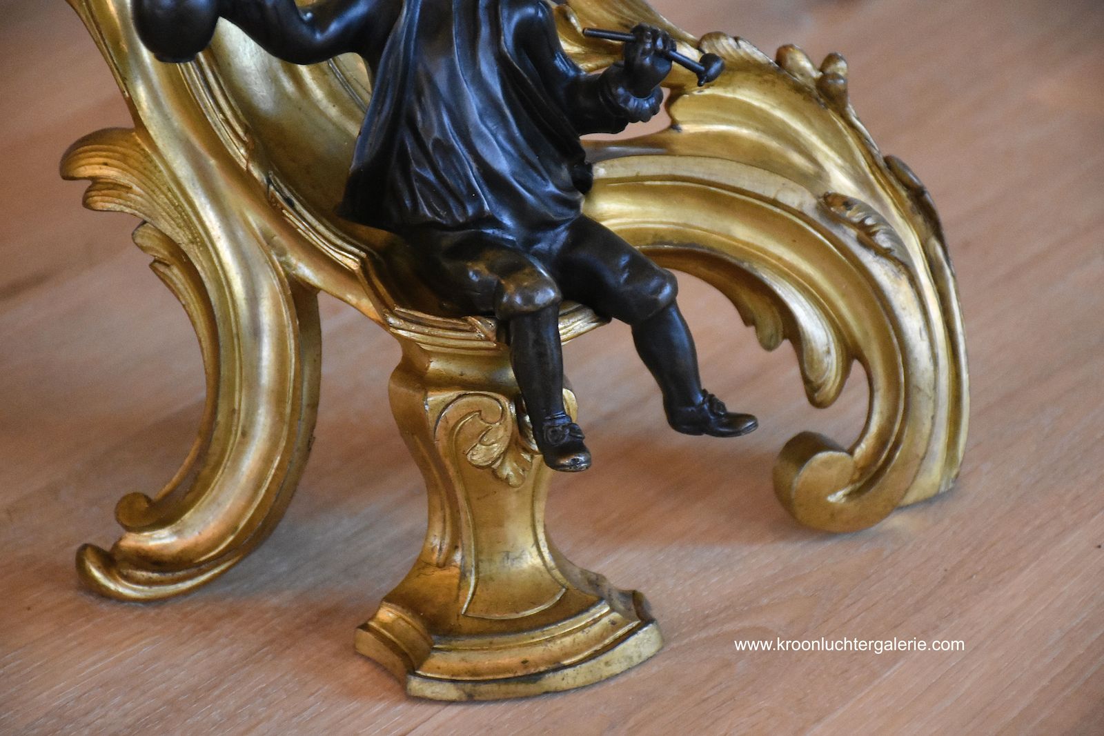 A pair of 19th c. gilt bronze chenets in the style of Louis XV