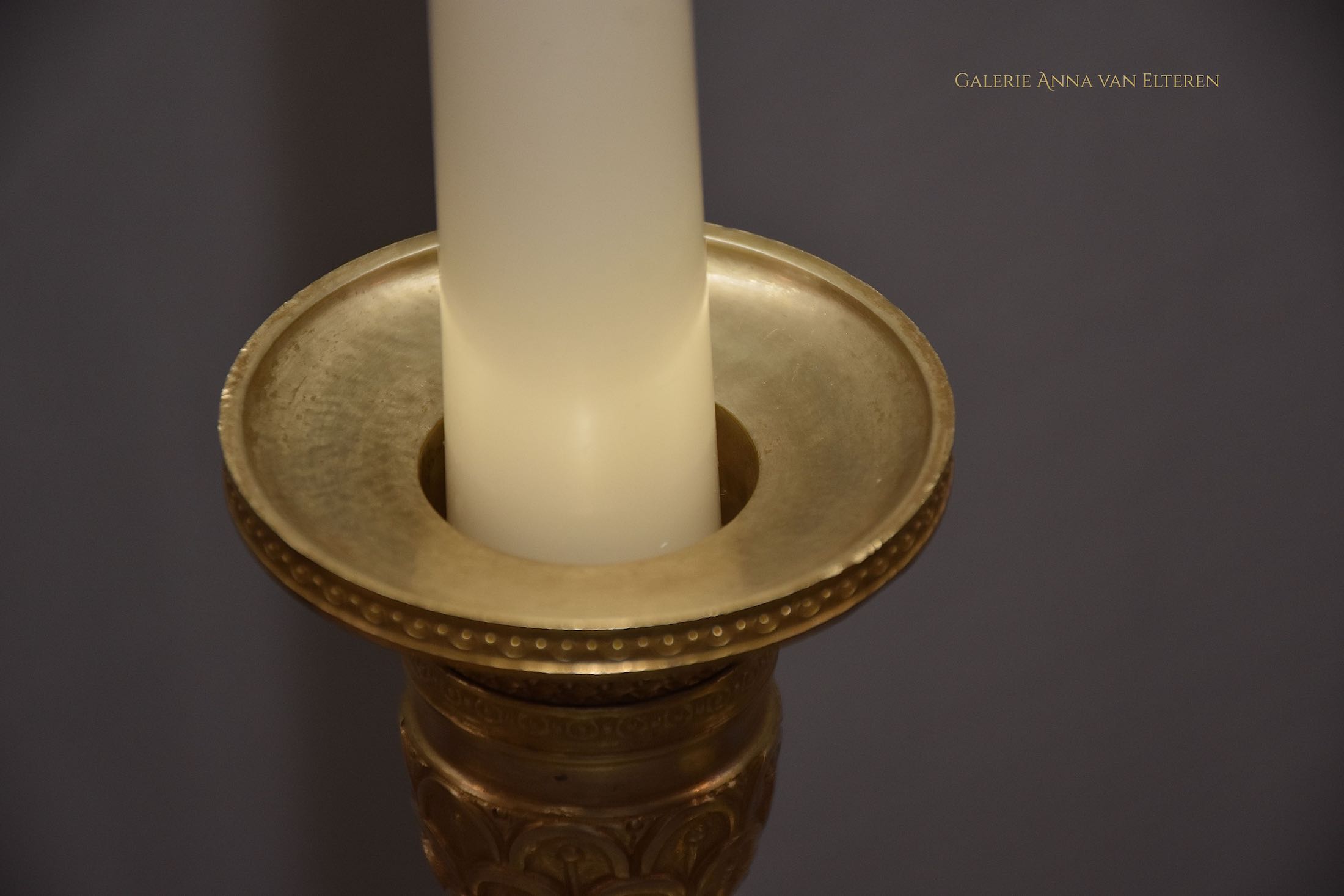 A pair of French Empire ormolu candlesticks