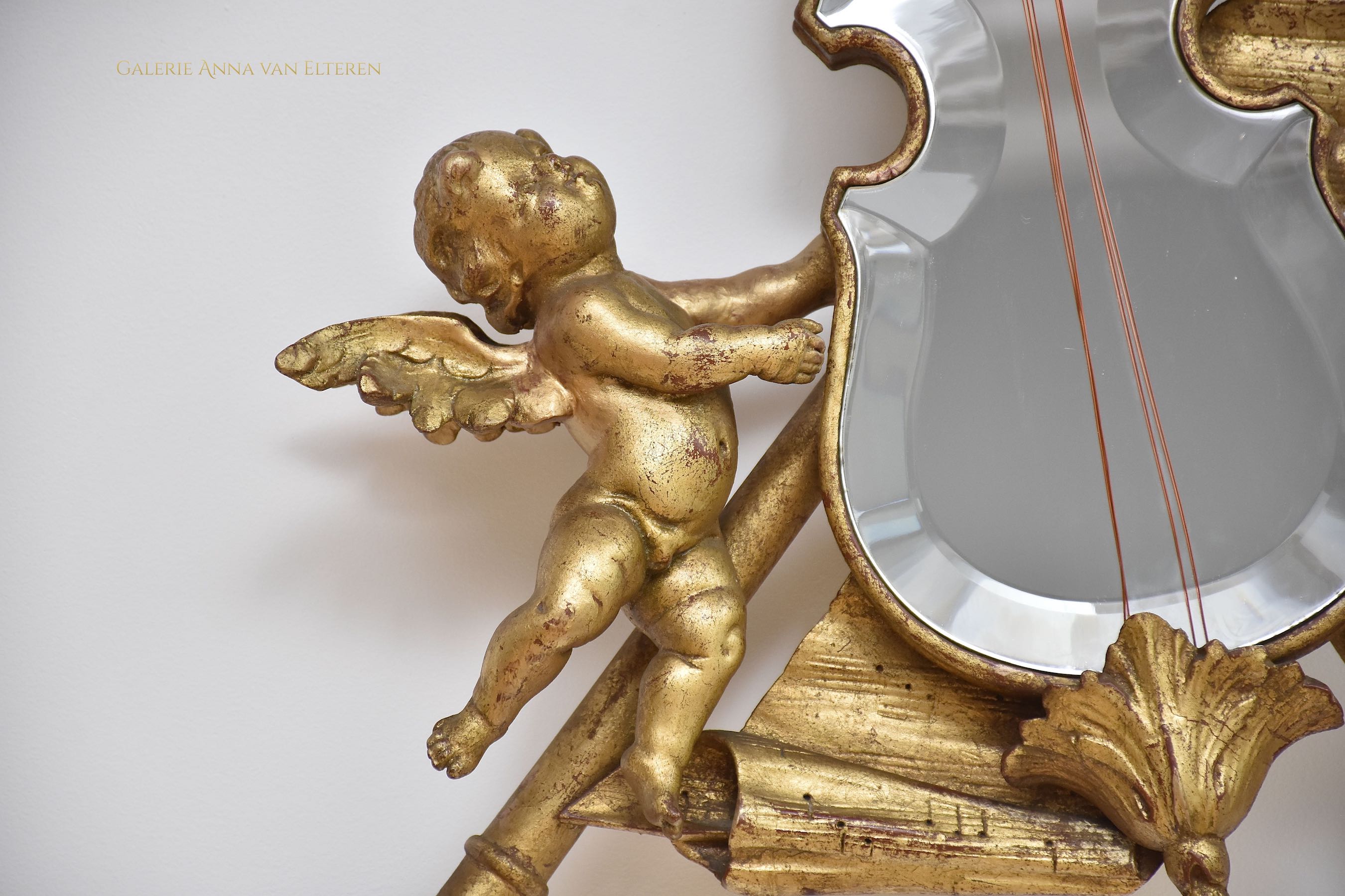 19th c. carved & gilded mirror with putti