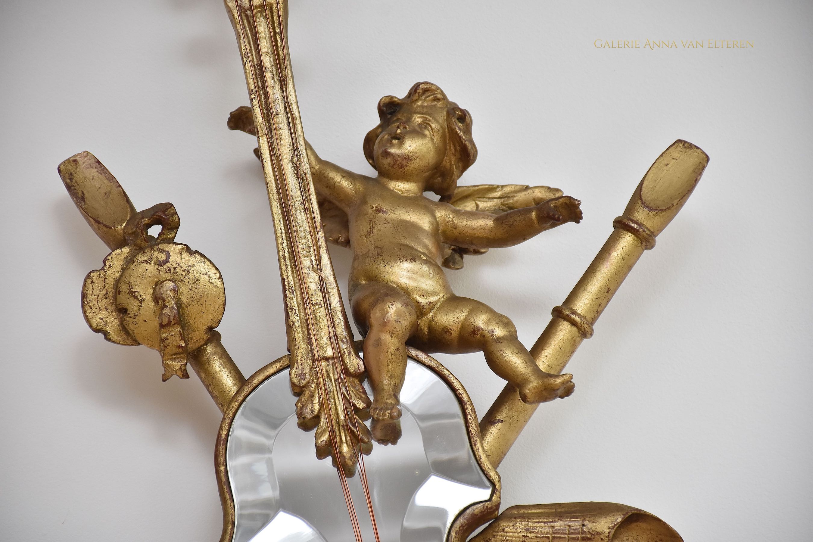 19th c. carved & gilded mirror with putti