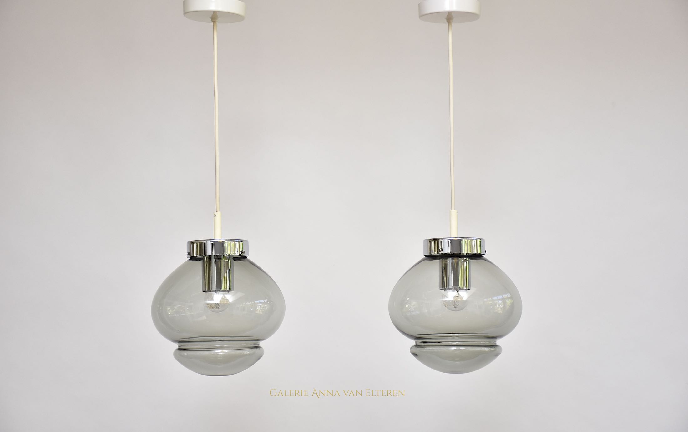 A pair of RAAK Amsterdam ceiling lamps