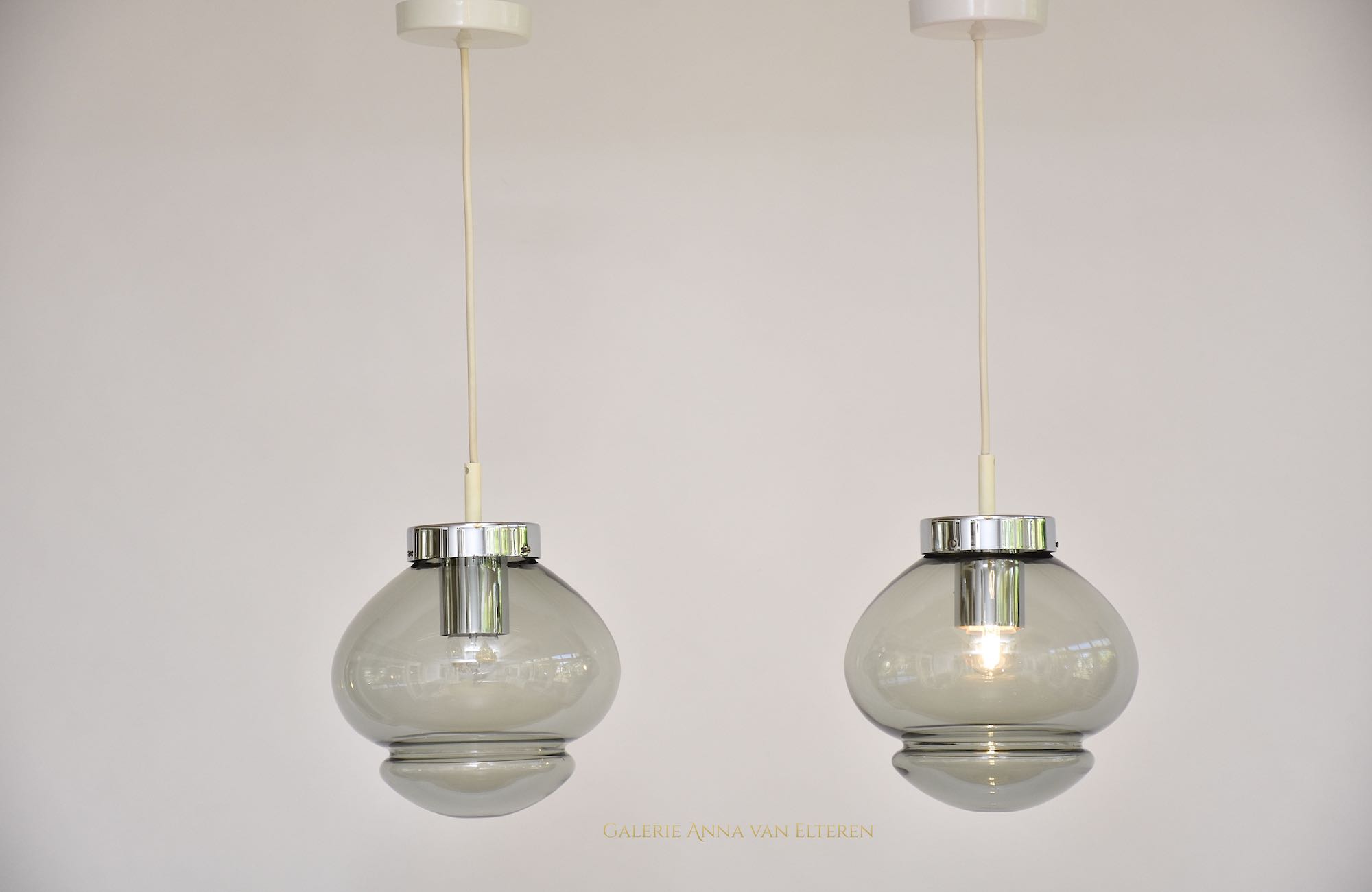 A pair of RAAK Amsterdam ceiling lamps