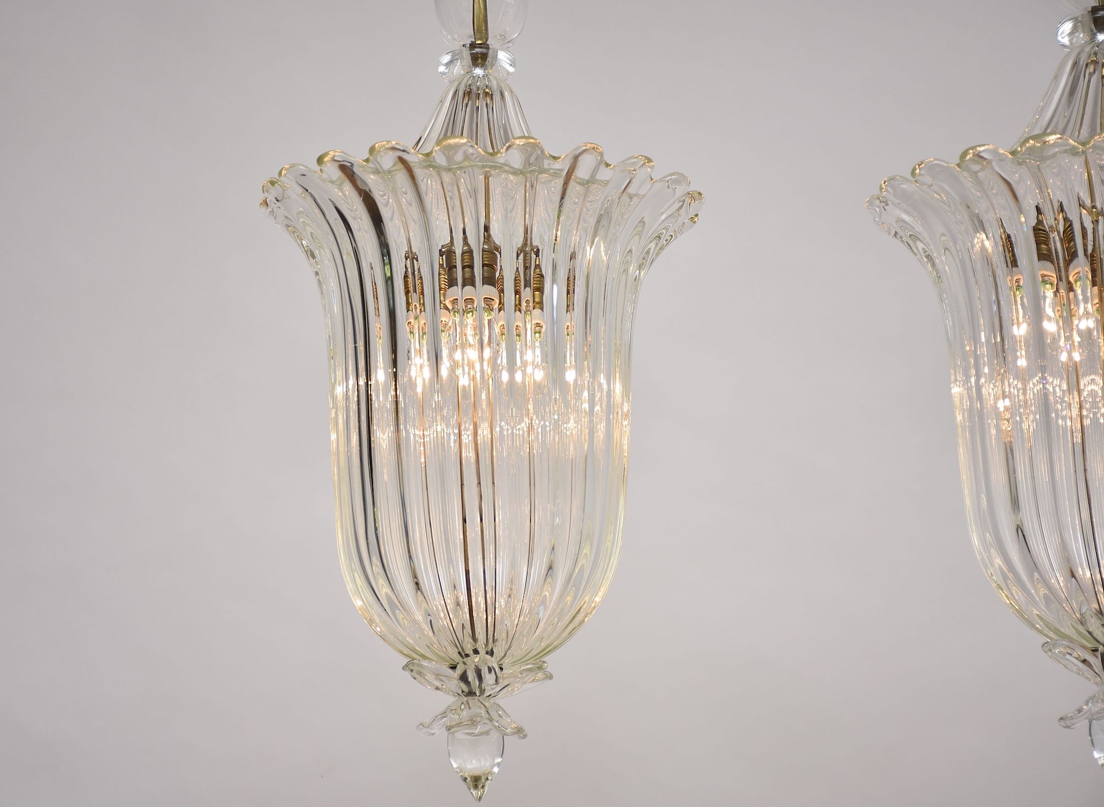 A pair of Seguso Murano glass and brass lantern/ pendants