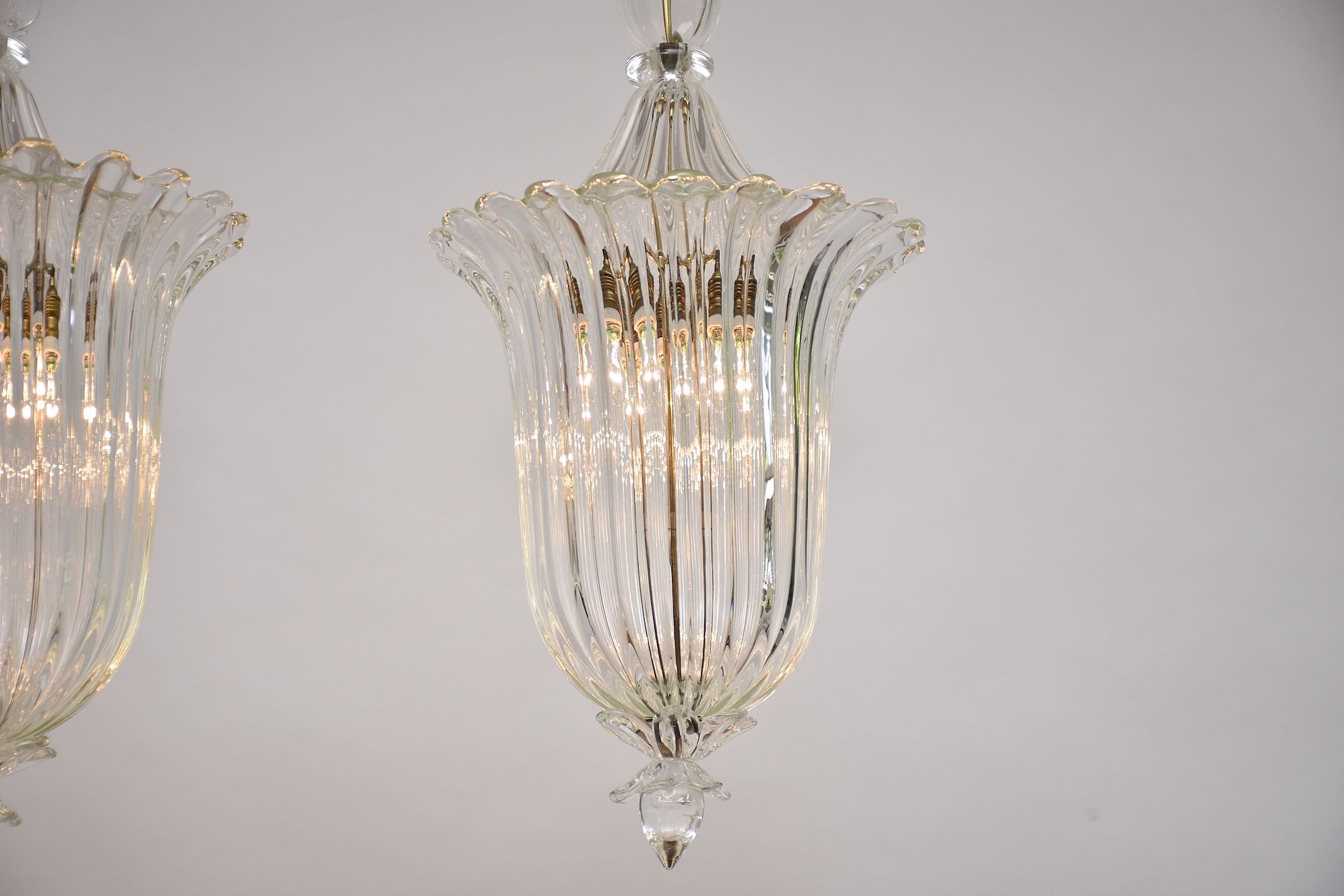 A pair of Seguso Murano glass and brass lantern/ pendants