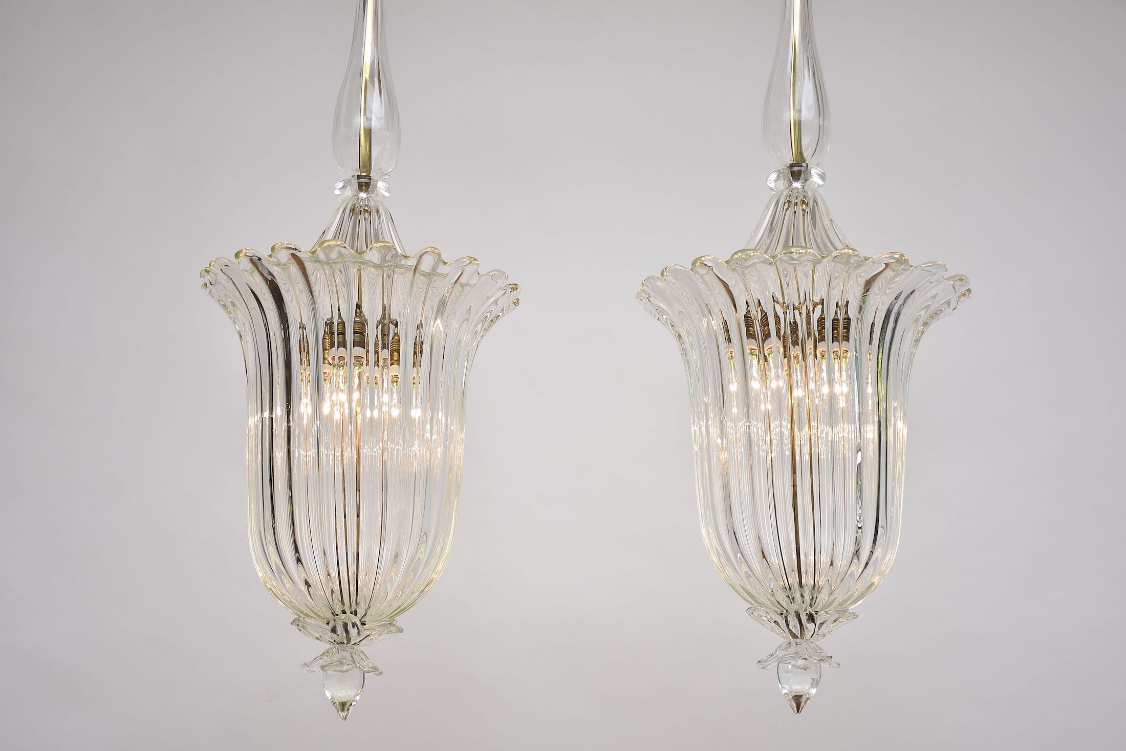 A pair of Seguso Murano glass and brass lantern/ pendants