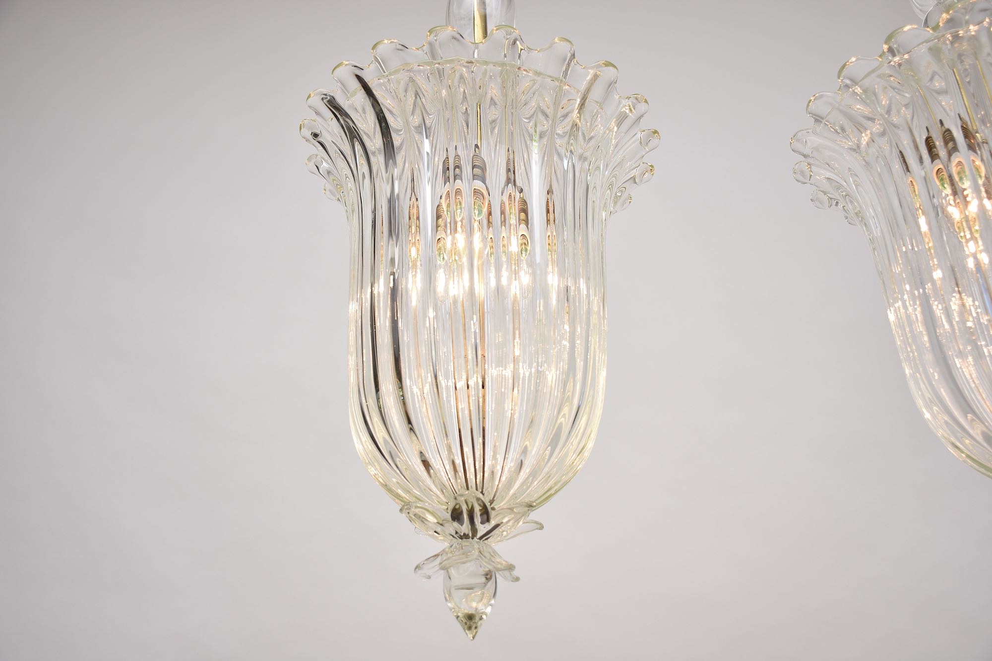 A pair of Seguso Murano glass and brass lantern/ pendants