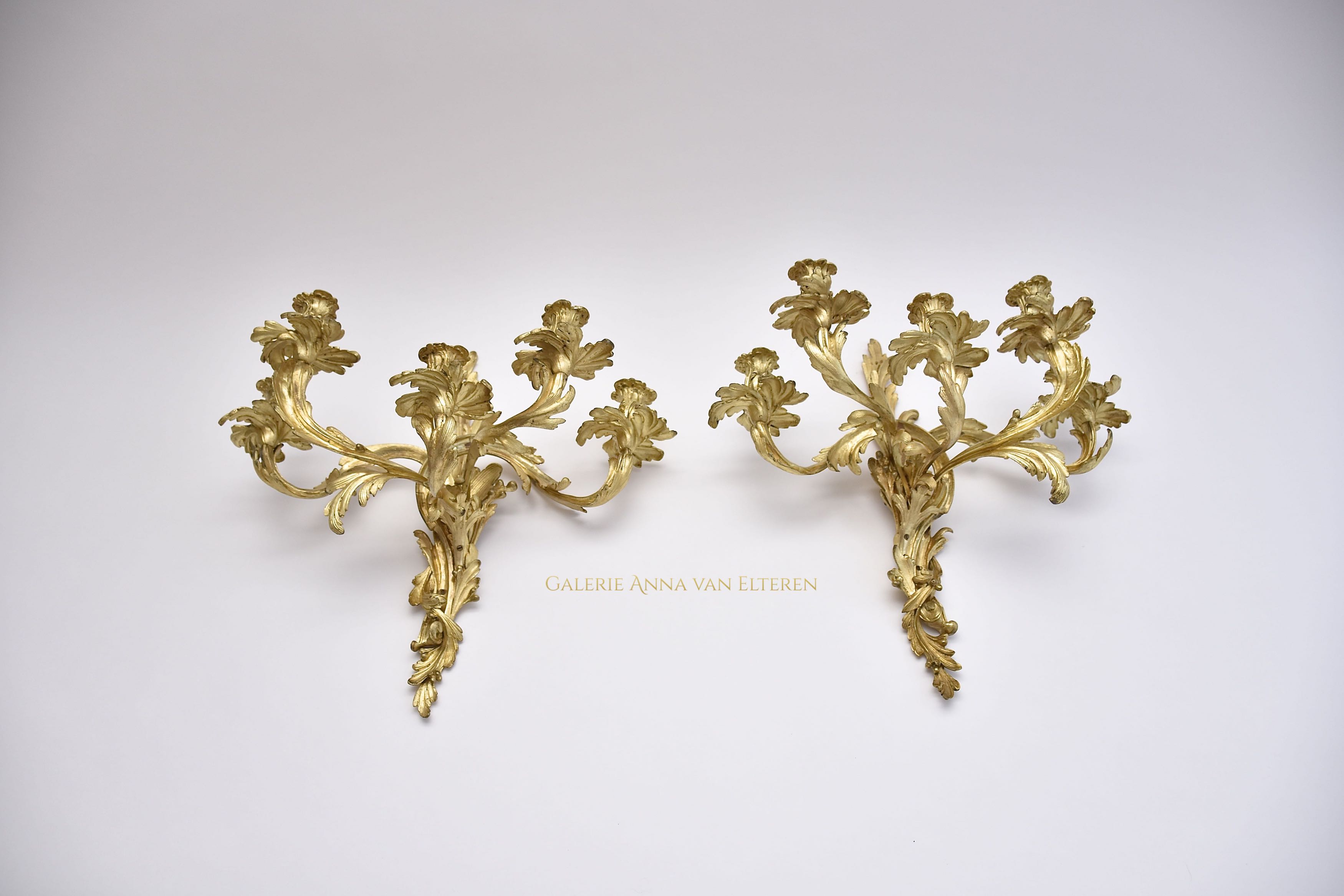 A pair of large gilt bronze wall appliques in the style of Louis XV