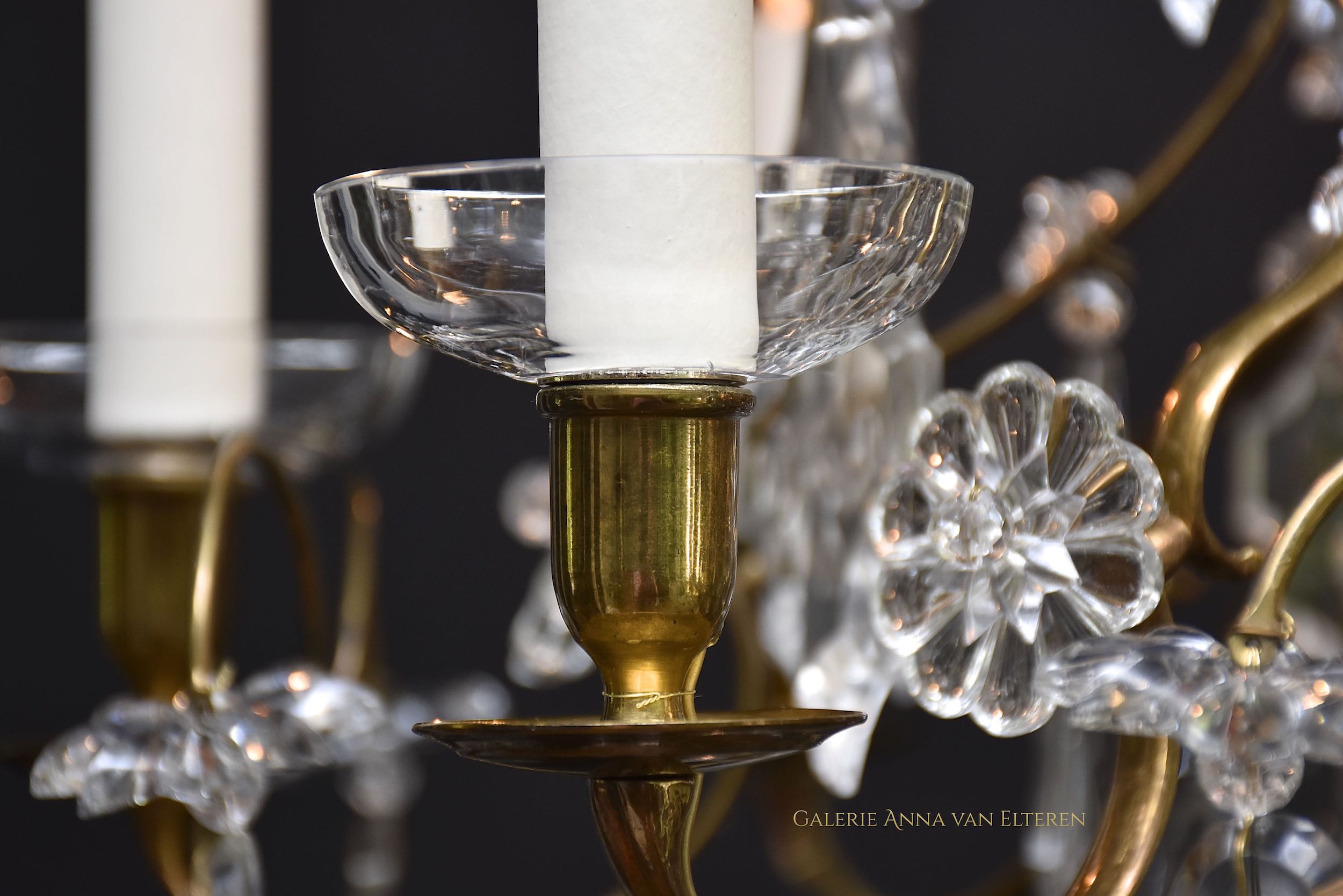 A pair of Rococo style crystal chandeliers