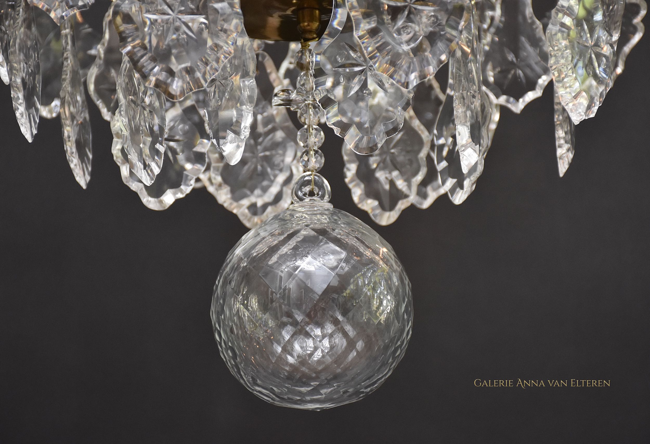 A pair of Rococo style crystal chandeliers