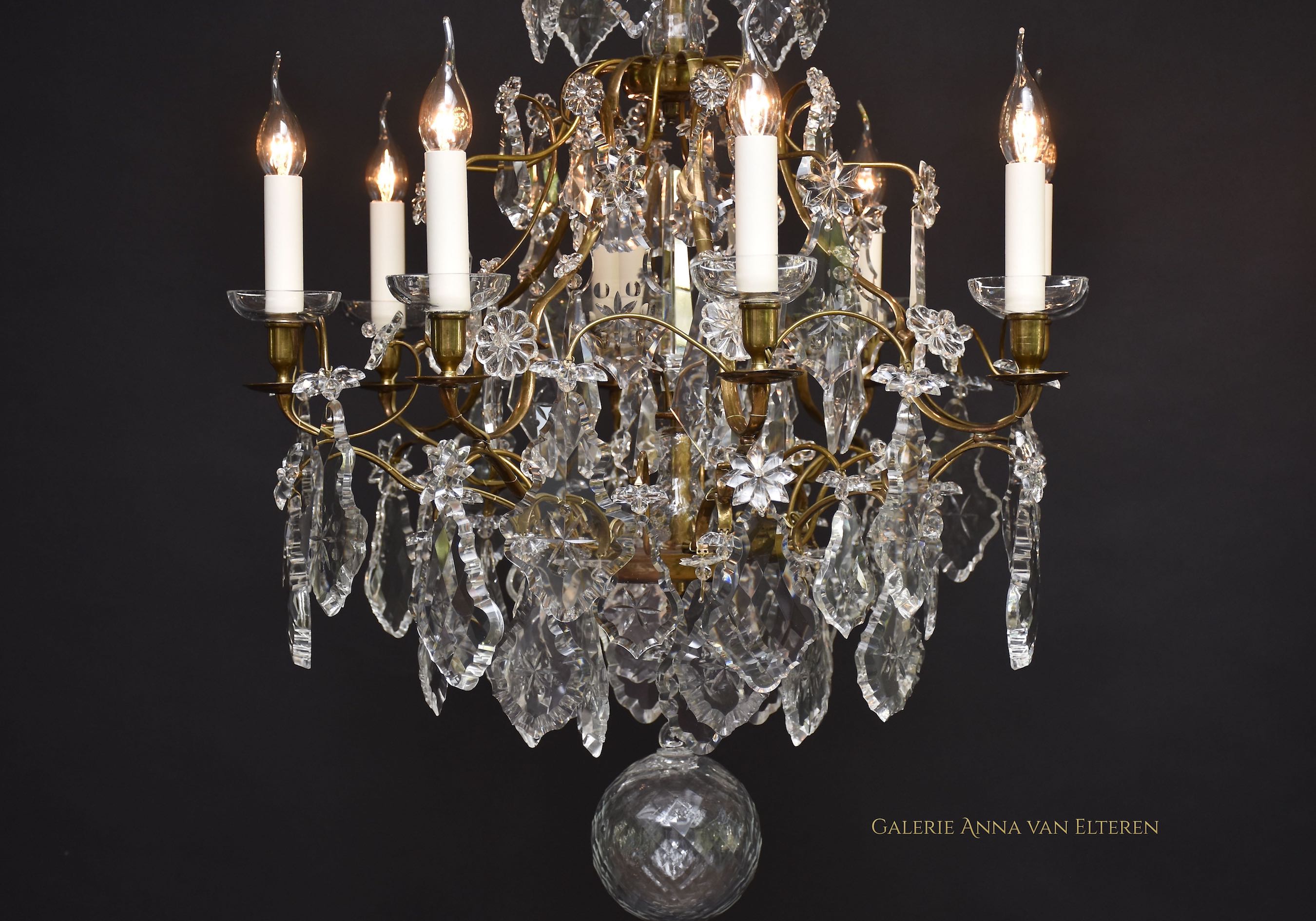 A pair of Rococo style crystal chandeliers