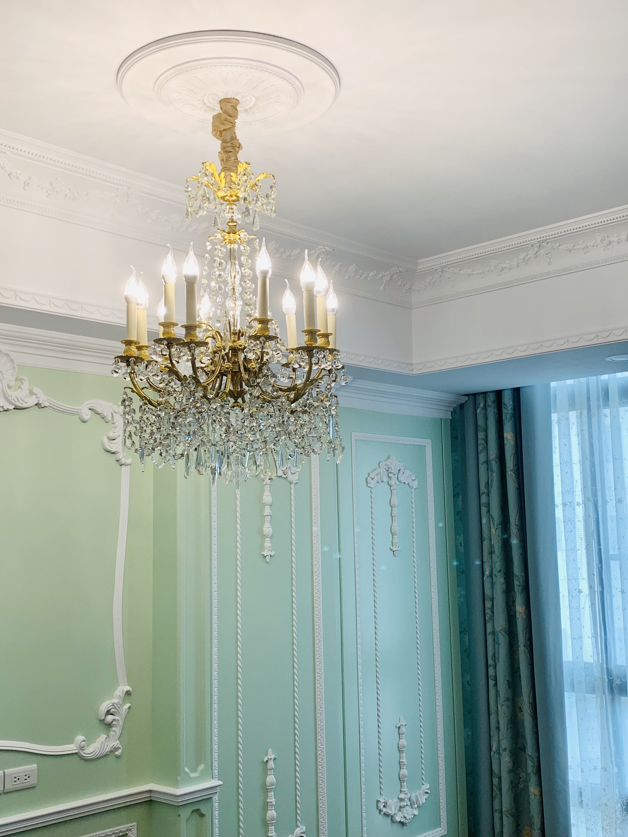 French chandelier in the style of Louis XVI in the bedroom