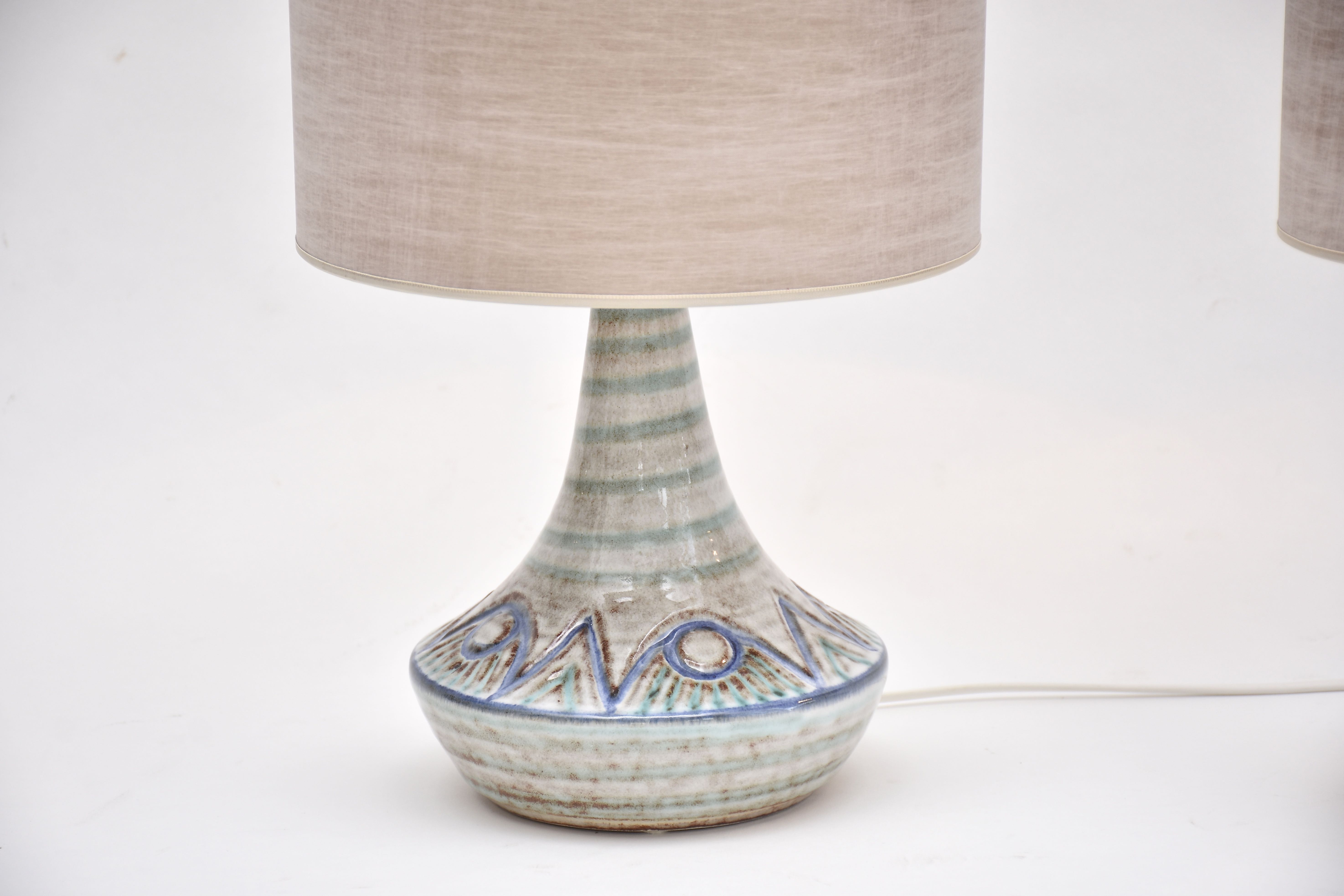 A pair of mid-century Danish ceramic table lamps in light blue/green by Soholm