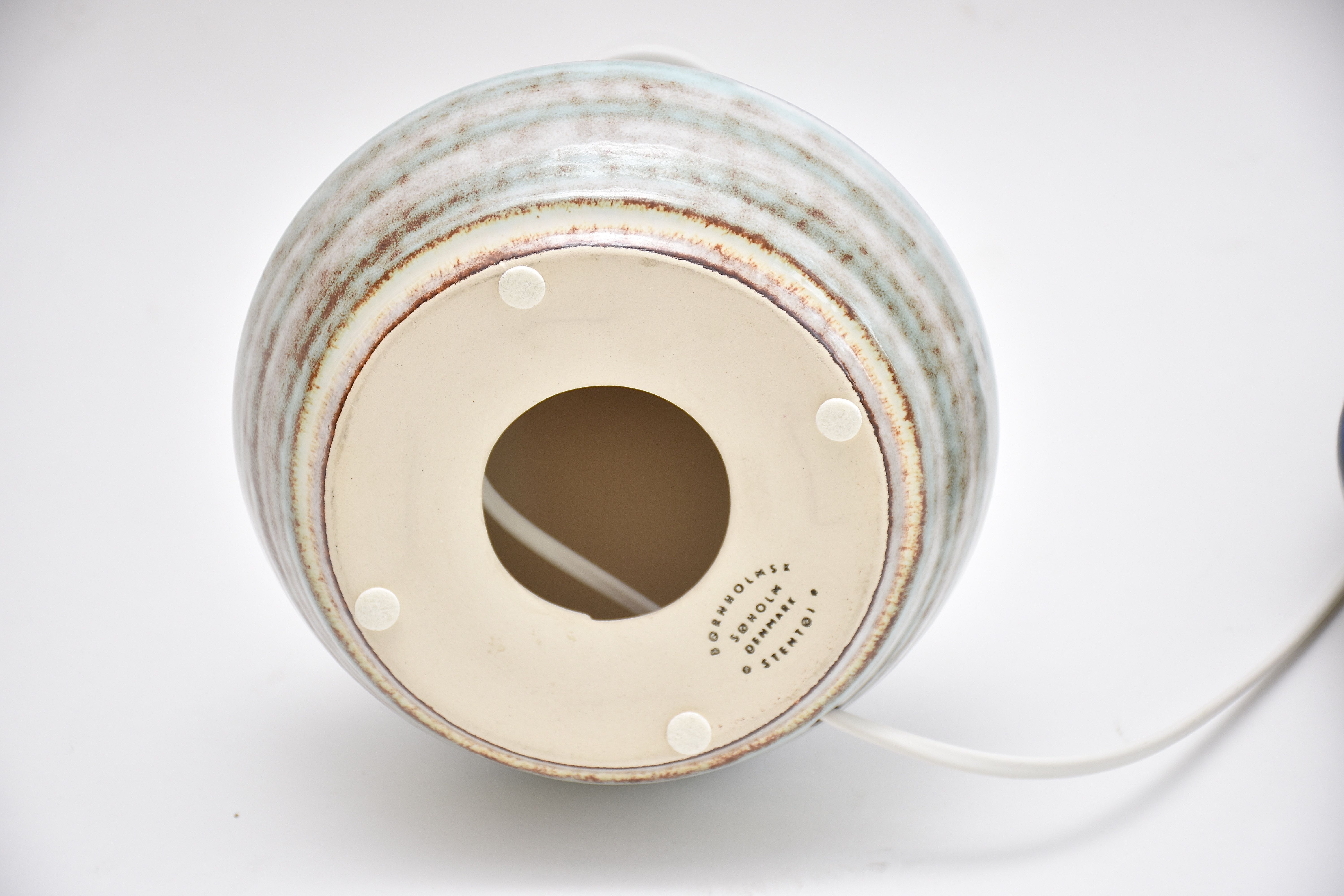 A pair of mid-century Danish ceramic table lamps in light blue/green by Soholm